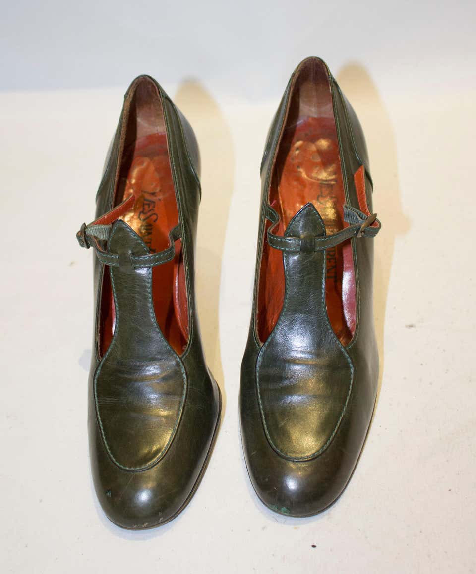 A pair of Vintage Yves Saint Laurent Paris Olive Green Leather Shoes