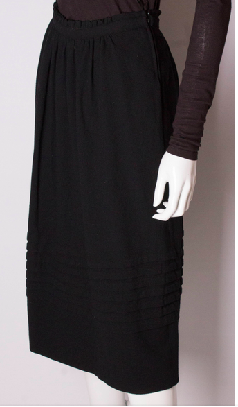 A vinatge 1970s Christian Dior black Wool Skirt modesandmore