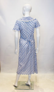 A vintage 1920s blue and white printed summer day dress