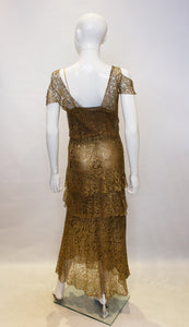 A vintage 1920s Gold Lame and Lace flapper Evening Dress