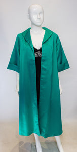 A vintage 1950s turquiose horrockses for harrods evening coat