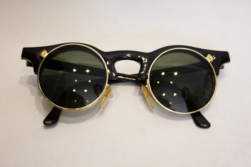 A pair of 1980s black linda farrow sunglasses