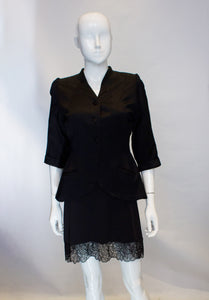 A Vintage 1940s Black Satin short sleeved Jacket