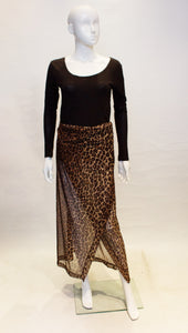 A vintage dolce and gabbana leopard print beach wrap skirt