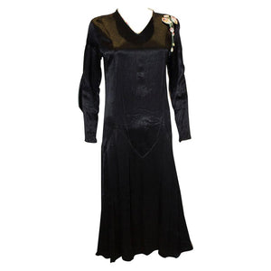 A Vintage Black Satin 1920s dress with floral trim