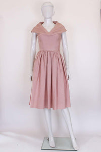 A vintage 1950s Dusty Pink Prom Style Vintage Dress