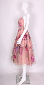 A vintage 1950s Handpainted Floral Pink Party Dress