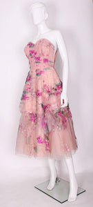 A vintage 1950s Handpainted Floral Pink Party Dress