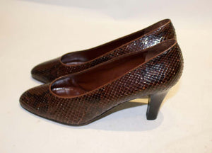A pair of Vintage Yves Saint Laurent Brown and Black Snakeskin Shoes
