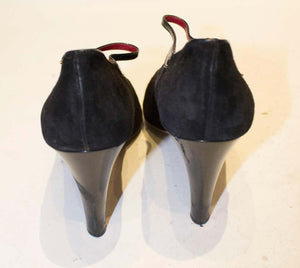 A pair of Vintage Yves Saint Laurent Paris Shoes in Black Patent and Suede