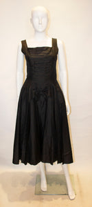 A Vintage 1950s Suzy Perette Black Cocktail Dress
