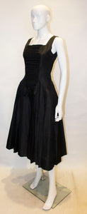 A Vintage 1950s Suzy Perette Black Cocktail Dress