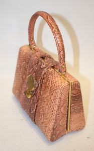 A Vintage 1960s Pink Snakeskin Top Handle Handbag