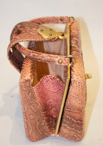 A Vintage 1960s Pink Snakeskin Top Handle Handbag